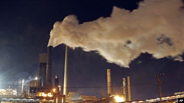 Smoke bellows from a chimney stack at BlueScope Steel's steelworks at Port Kembla, south of Sydney, Australia, 1 Jul, 2012.