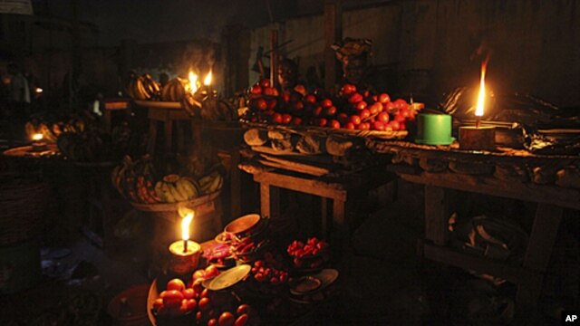 Vegetable sellers ply their wares by the light of locally-made lanterns in Lagos, Nigeria (file photo). 