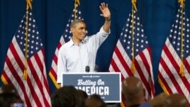 President Barack Obama waves at Dobbins Elementary School in Poland, Ohio during his Betting On America campaign tour, July 6, 2012.