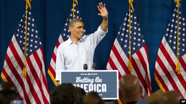 President Barack Obama waves at Dobbins Elementary School in Poland, Ohio during his Betting On America campaign tour, July 6, 2012.