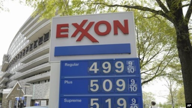 Gas prices above $1.31 per liter ($5 per gallon) are seen on a sign at a gas station in Washington, April 20, 2011