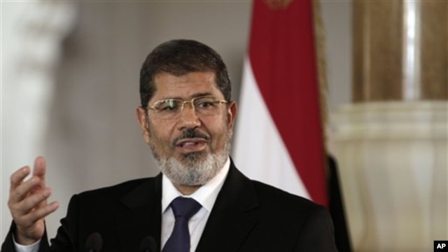 Egyptian President Mohammed Morsi speaks to reporters after meeting Tunisian President Moncef Marzouki in Cairo, Friday, July 13.