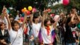 Participants take part in a flash mob during a lesbian, gay, bisexual, and transgender (LGBT) event on a street in Hanoi, Oct. 27, 2013.