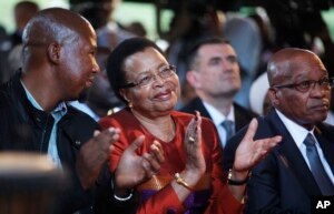 From Left: Mandla Mandela, grandson of former president Nelson Mandela, Graca Machel, wife of Mandela, and president Jacob Zuma attend the opening of the revamped Nelson Mandela Centre of Memory in Johannesburg, Nov. 18, 2013.