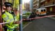 A police officer guards a block of flats in Greenwich following a raid in connection with the killing of a British soldier in nearby Woolwich, southeast London, May 23, 2013.