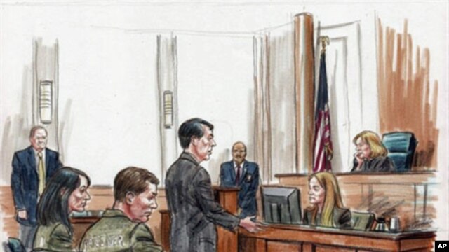 Alleged Russian spy suspects Patricia Mills and Michael Zottoli are seated (left foreground) in US federal court , 02 Jul 2010