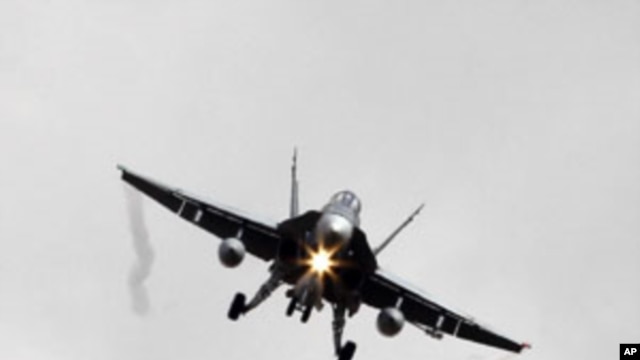 A Canadian CF-18A fighter plane prepares to land at the Birgi NATO Airbase in Trapani in the southern Italian island of Sicily, March 19, 2011