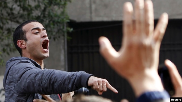 Activist Ahmed Doma shouts slogans against Egyptian President Mohamed Morsi and the Muslim Brotherhood during the funeral of activists Mohamed el-Gendy and Amr Saad in Cairo February 4, 2013.