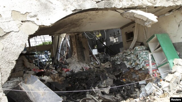 Burnt newspaper copies are seen in the rubble of a destroyed ThisDay newspaper building in Abuja April 28, 2012.