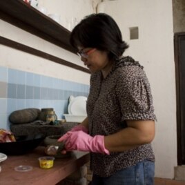Nazlina Hussin preparing ingredients for her cooking class that is held in a rented pre-war shop house in Georgetown, Penang.