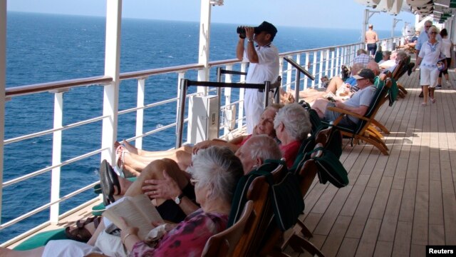 A watchkeeper is seen on the deck of the Queen Mary 2 in the southern Red Sea, January 24, 2013.