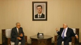 Progress in rebel efforts to create alternative government has been stalled by some in Syrian National Coalition who believe another route to peace may be achieved by UN-Arab League special envoy to Syria Lakhdar Brahimi, shown here with Syria’s foreign minister, Walid Mouallem. on September 13, 2012.  (AP)
