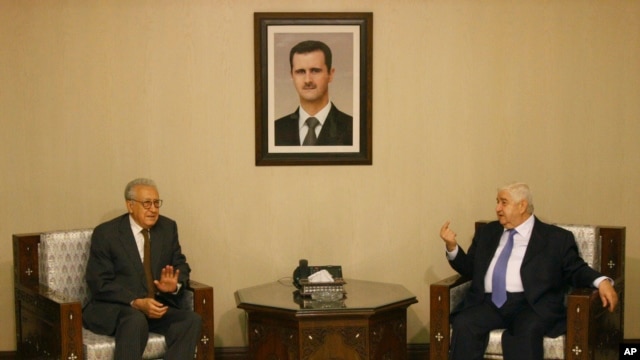 Progress in rebel efforts to create alternative government has been stalled by some in Syrian National Coalition who believe another route to peace may be achieved by UN-Arab League special envoy to Syria Lakhdar Brahimi, shown here with Syria’s foreign minister, Walid Mouallem. on September 13, 2012.  (AP)