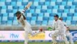 Pakistan's Asad Shafiq bats as England's Jos Buttler looks on during a Pakistan-England match at Dubai International Stadium, United Arab Emirates on Oct. 22, 2105.