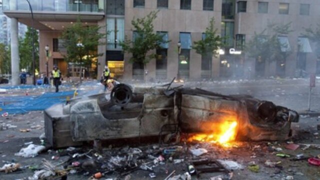 The wreckage of a car in Vancouver the day after fans rioted in reaction to the Vancouver Canucks' defeat by the Boston Bruins in the NHL Stanley Cup final