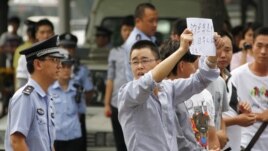 Demonstrators protest outside the Japanese embassy in Beijing on Sept. 11, 2012.