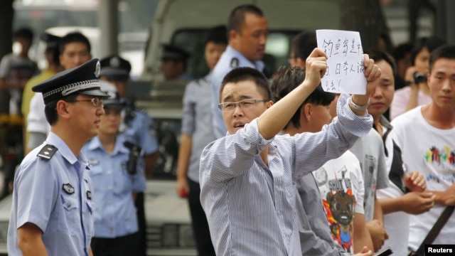 Demonstrators protest outside the Japanese embassy in Beijing on Sept. 11, 2012.