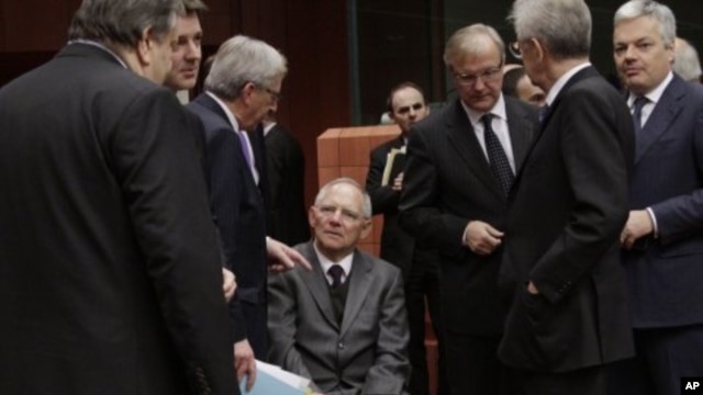 From left, Greek Finance Minister Venizelos, French Finance Minister Baroin, Luxembourg's PM Juncker, German Finance Minister Schaeuble, European Commissioner for the Economy Olli Rehn, Italian PM and Finance Minister Mario Monti and Belgium's Finance Min