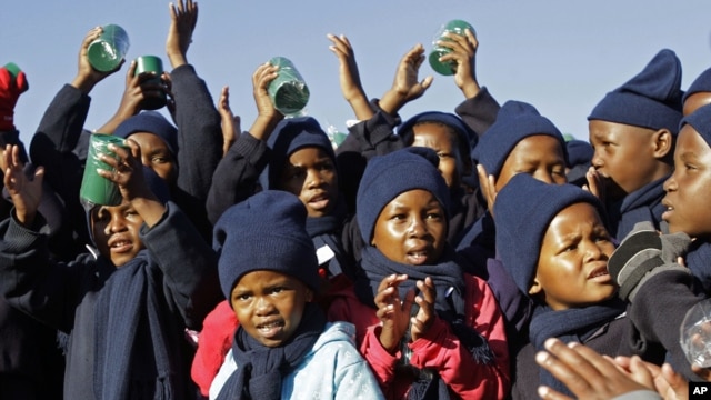 Children sing 'Happy Birthday' in honor of former South African President Nelson Mandela during celebrations for Mandela's birthday in Mvezo, South Africa, July 18, 2012.