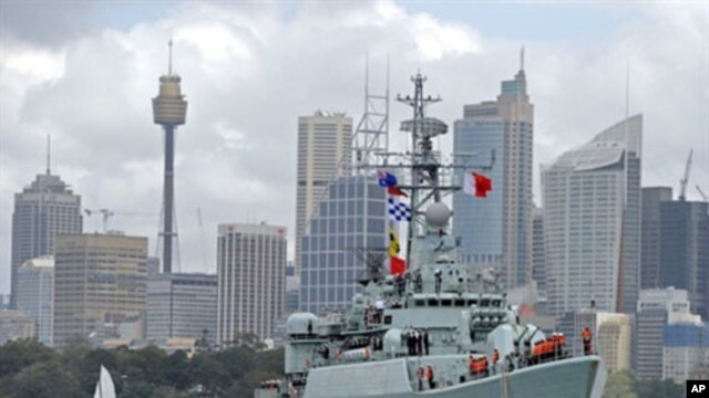 China's People's Liberation Army (PLA) naval frigate 'Mianyang' maneuvres towards the Garden Island naval base in Sydney Harbour, 20 Sep 2010