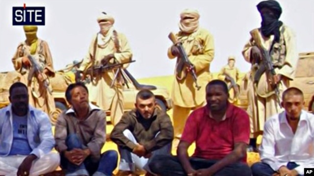 Image taken from video and provided by U.S.-based SITE Intelligence Group shows the first images of a group of foreign hostages working for a French energy company who were seized in Niger two weeks ago by an al-Qaida offshoot, according to the group that
