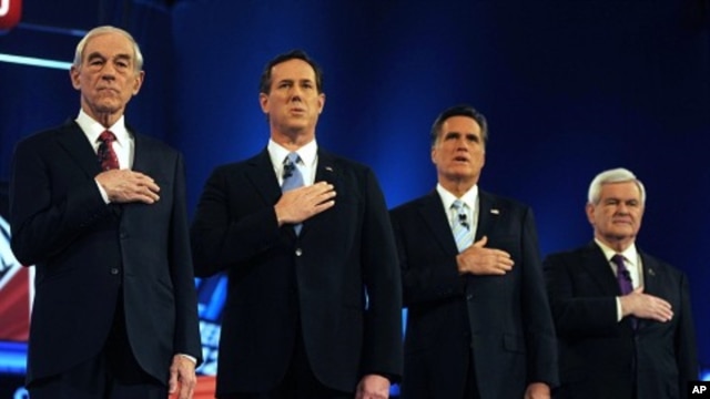 U.S. Republican presidential candidates (L to R) U.S. Rep. Ron Paul, former U.S. Senator Rick Santorum, former Massachusetts Governor Mitt Romney and former Speaker of the House Newt Gingrich stand for the National Anthem before the start of the Republica