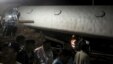 Police and members of the rescue operation stand at the site of a train derailment near Harda, Madhya Pradesh in this handout provided by ANI on August 5, 2015. 
