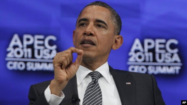 President Barack Obama answers questions from  Boeing Chief Executive Officer Jim McNerney as he attends the APEC CEO Summit in Honolulu, Hawaii, Nov. 12, 2011.
