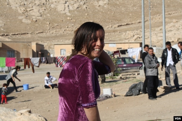 Khalifa, after telling VOA about her year in Islamic State captivity, hurries off to visit with friends and family on Nov. 25, 2016, near Dohuk, Kurdistan, Iraq. (H. Murdock/VOA)