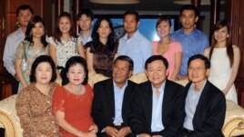 Hun Sen's family includes (back R-L) Hun Sen's daughter-in-law Chay Lin, Hun Sen's son-in-law Dy Vichea and his wife Hun Mana, Hun Sen's son Hun Manet and his wife (unidentified), Hun Sen's son-in-law Sok Puthivuth and his wife Hun Maly and Hun Sen's son Hun Manith and his wife (unidentified).  (Front L-R) Somchai's wife Yaowapa Wongsawasdi and Hun Sen's wife Bun Rany.   