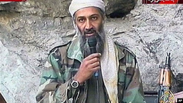 This image made from video broadcast on Sunday, Oct. 7, 2001 shows Osama bin Laden at an undisclosed location. Al-Qaida leader Osama bin Laden threatened in a new audio tape to kill French citizens to avenge their country's support for the U.S.-led war in