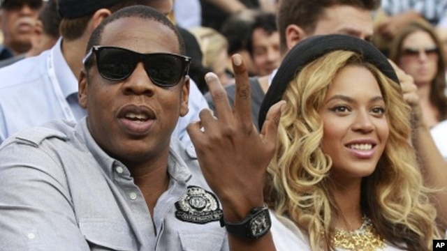 Rapper Jay-Z and his wife, singer Beyonce, attend the match between Novak Djokovic of Serbia and Rafael Nadal of Spain during the men's final of the U.S. Open tennis tournament in New York (file photo)