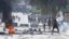 Supporters of Islamist group Ansar al-Sharia clash with riot police at Hai al-Tadamon in Tunis May 19, 2013. 