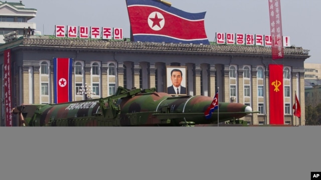 North Korean vehicle carrying a missile passes by during a mass military parade to celebrate the centenary of the birth of late N. Korean founder Kim Il Sung, April 15, 2012.