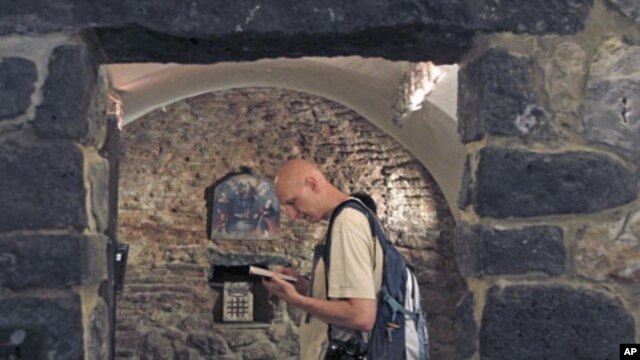 A tourist visits the St. Ananias church, dating back to the first century, in Damascus June 3, 2010 (file photo)