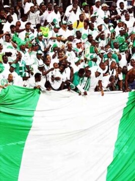 Nigerian soccer supporters unfurl a massive national flag during a 2009 World Cup qualifier in Lagos...Super Eagles fans are expected to "go crazy" during the World Cup in South Africa