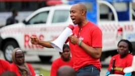 Chidi Odinkalu, chairman of Nigeria's National Human Rights Commission, addresses a gathering of people at a speak-out session of a #BringBackOurGirls rally in Lagos, Nigeria, June 7, 2014. 