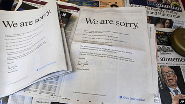 Newspapers at a news vendor in central London, with the advertisement apology for News International, July 16, 2011. News Corporation chairman Rupert Murdoch signed the company advert entitled "We are sorry",  which appears in British national newspapers.