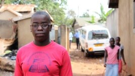 Phiona Mutesi stands near where she grew up in Katwe slum, Kampala, Uganda, January 28, 2012. (H. Heuler/VOA)