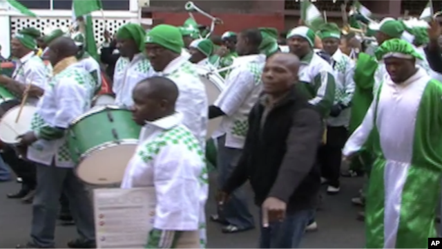 Nigerian fans parade through the Hillsborough neighborhood of Johannesburg before their team's first game in the World Cup tournament.