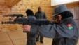 Afghan policewomen aim their guns during shooting exercises at the Afghan National Police Academy shooting range, in Kabul December 9, 2012.