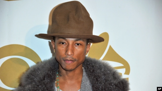 Pharrell Williams arrives at "The Night That Changed America: a Grammy Salute to the Beatles," Jan. 27, 2014, in Los Angeles