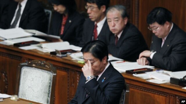 Japanese Prime Minister Yoshihiko Noda is seated after delivering his policy speech at the opening of the ordinary diet session at parliament in Tokyo, January 24, 2012.