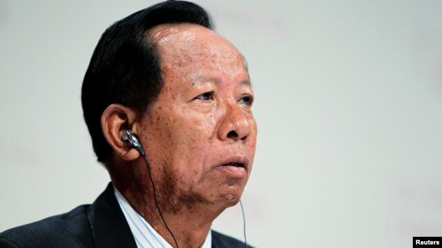 FILE - General Tea Banh, Cambodia's Defense Minister, waits for his turn to speak at 11th International Institute of Strategic Studies Asia Security Summit, in Singapore, June 2012.
