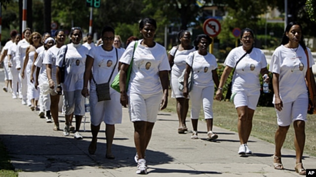 Members of dissident group Ladies in White take part in a march in this file photo. Some 90 members and supporters of the group were among those reportedly detained.   