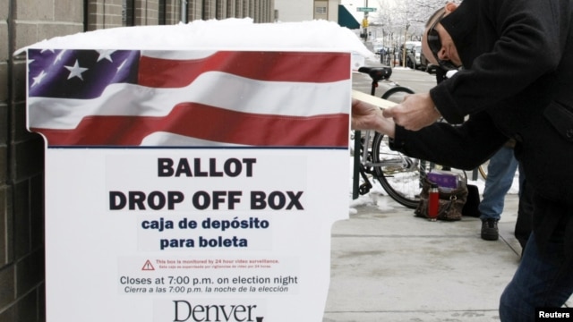 A voter participates in early balloting outside the Denver Elections Division in downtown Denver, Colorado on October 25, 2012. 