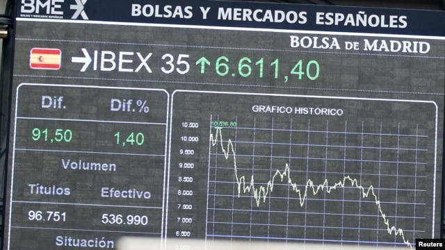 Electronic boards at the Madrid stock exchange, Spain, June 19, 2012. 
