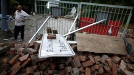 A man looks at a barricade set up by activists in Istanbul, Turkey on June 5, 2013.