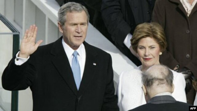 President George W. Bush takes the oath of office for his second term on January 20, 2005, with his wife Laura at his side