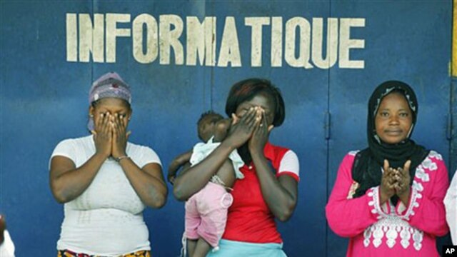 Christian and Muslim supporters of Alassane Ouattara participate in a special Muslim prayer in honor of the civilians killed in three months of post-election violence, following Friday prayers at a mosque in the Treichville neighborhood of Abidjan, Ivory 